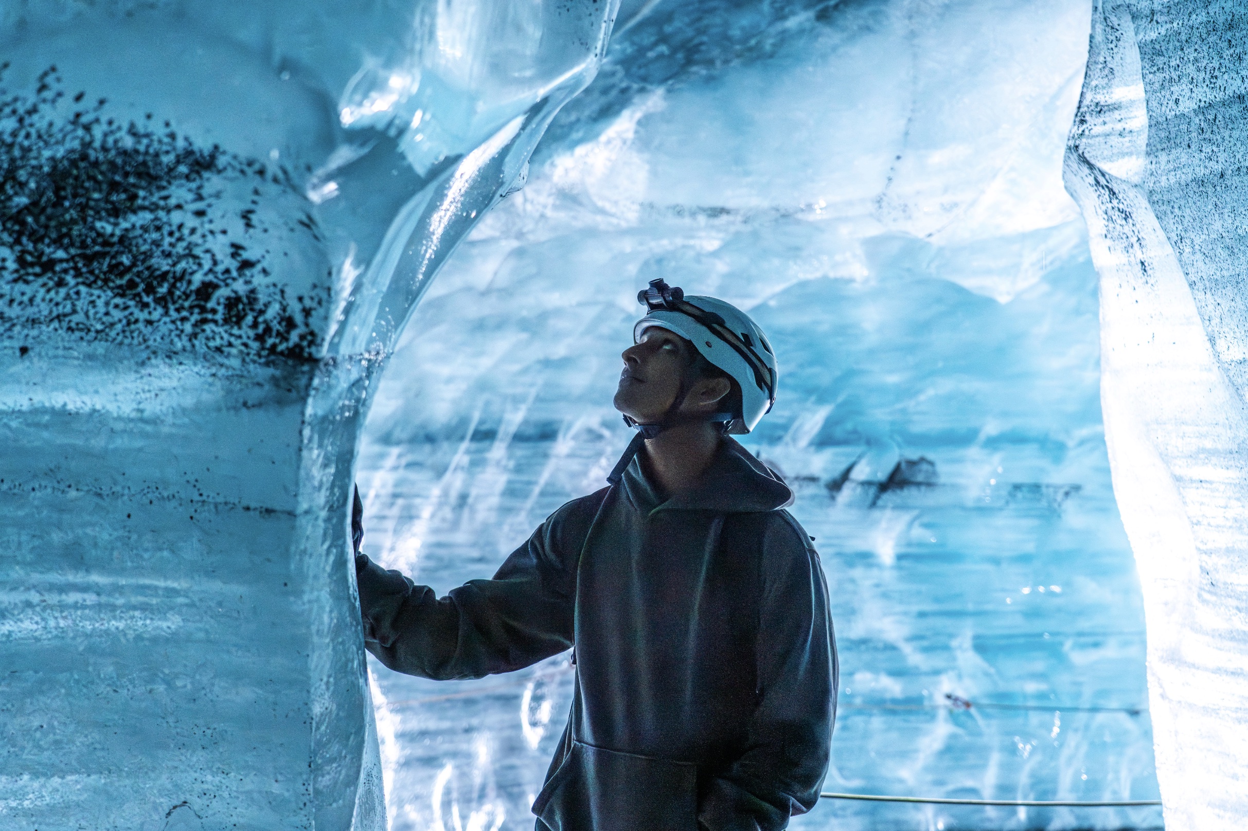 Anand exploring a blue ice cave